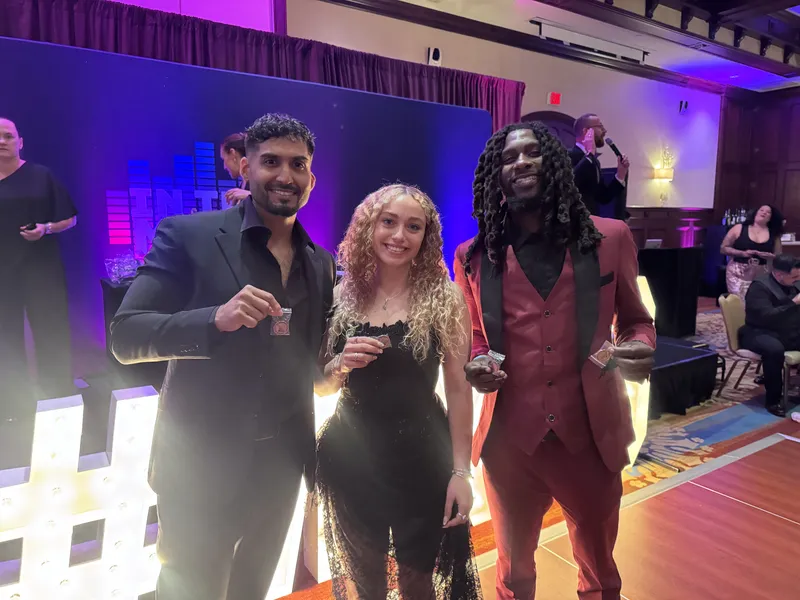 Top performers celebrating at an awards gala